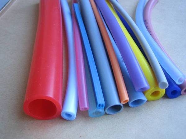 Several heat resisting silicone tubes are displayed on the table.